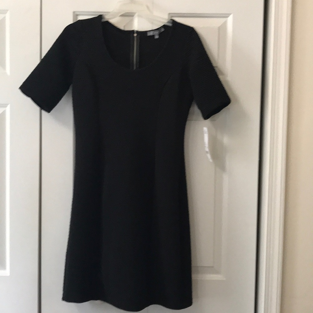 Black knee length dress with silver zipper